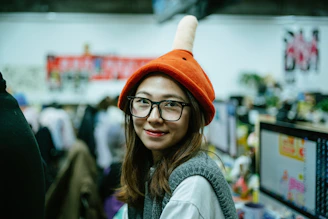 A confident neurodivergent woman leading a diverse team in a bright, collaborative workspace.