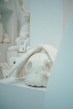 A softly lit display of crystal skulls glowing gently inside the Simple Temple exhibit.