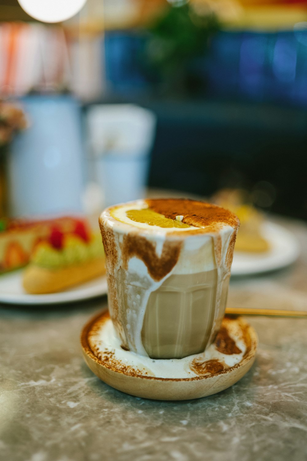 a cup of coffee on a saucer on a table