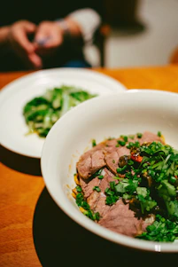 a close up of a bowl of food on a table