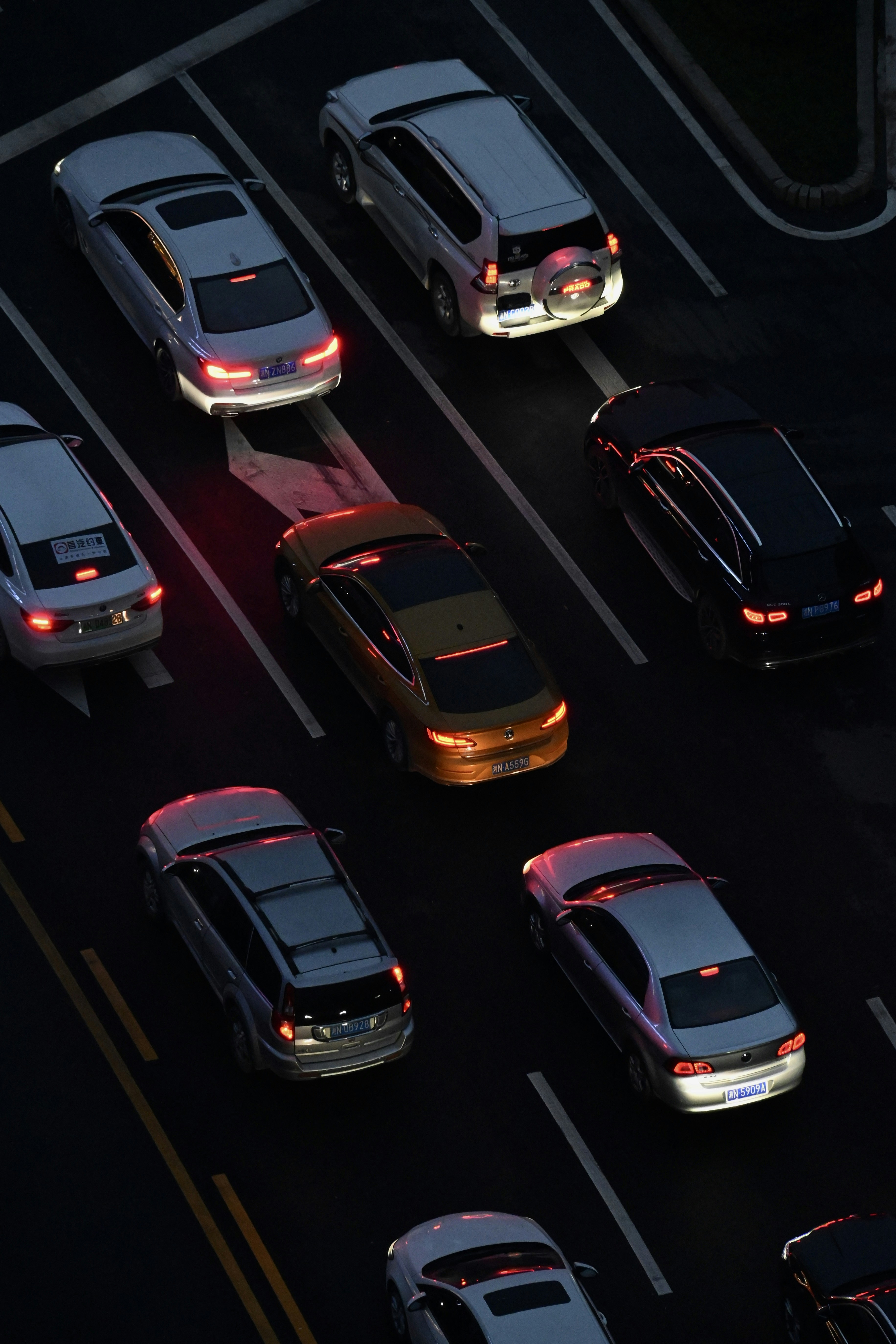 a group of cars that are sitting in the street