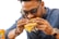 A happy customer enjoying a delicious burger at crust & smoke.