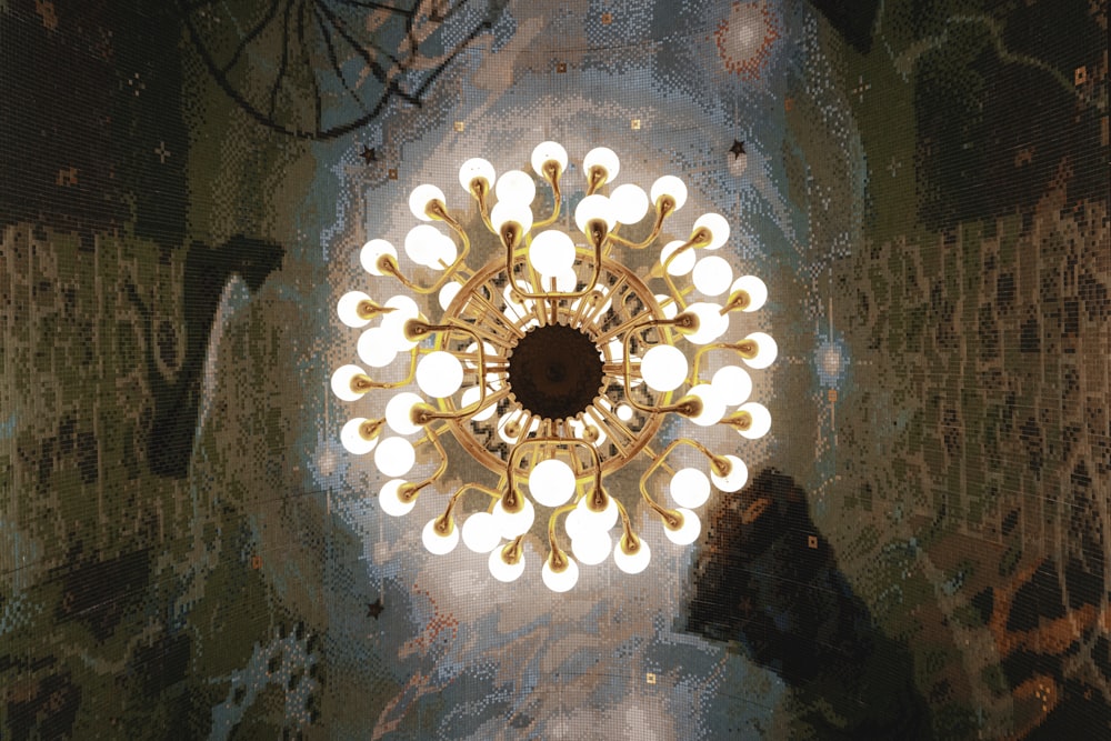 a chandelier hanging from the ceiling in a room