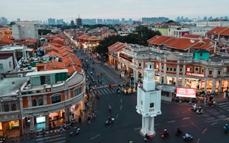 an aerial view of a city with a clock tower