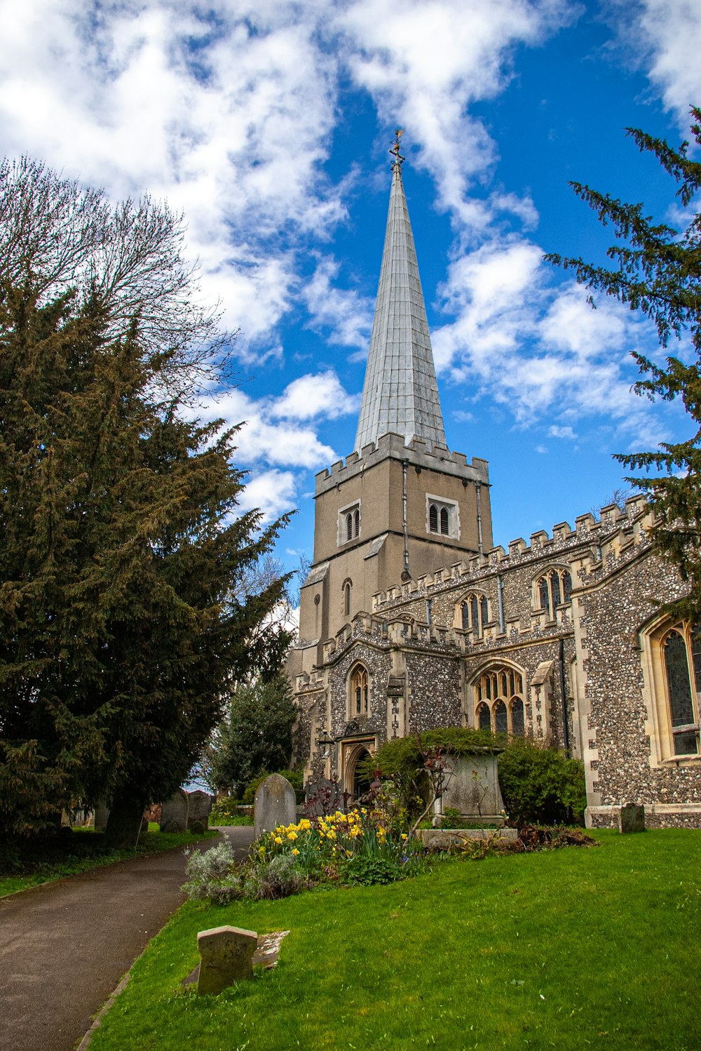 a church with a steeple on a sunny day