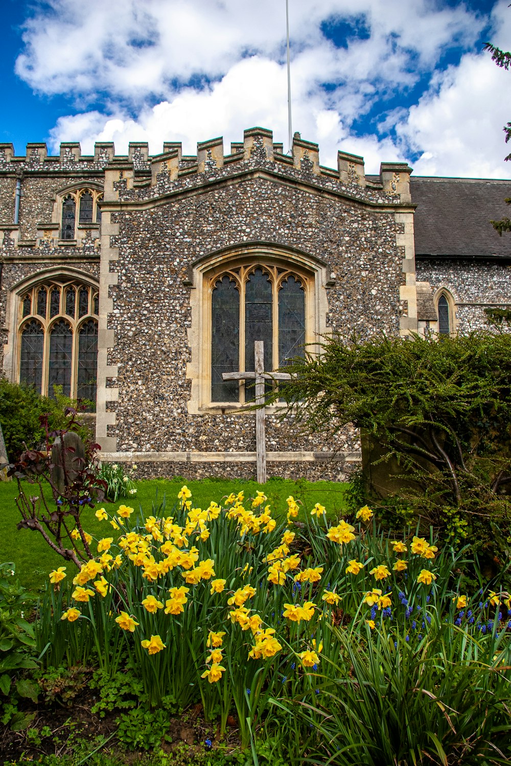 a building with a bunch of flowers in front of it