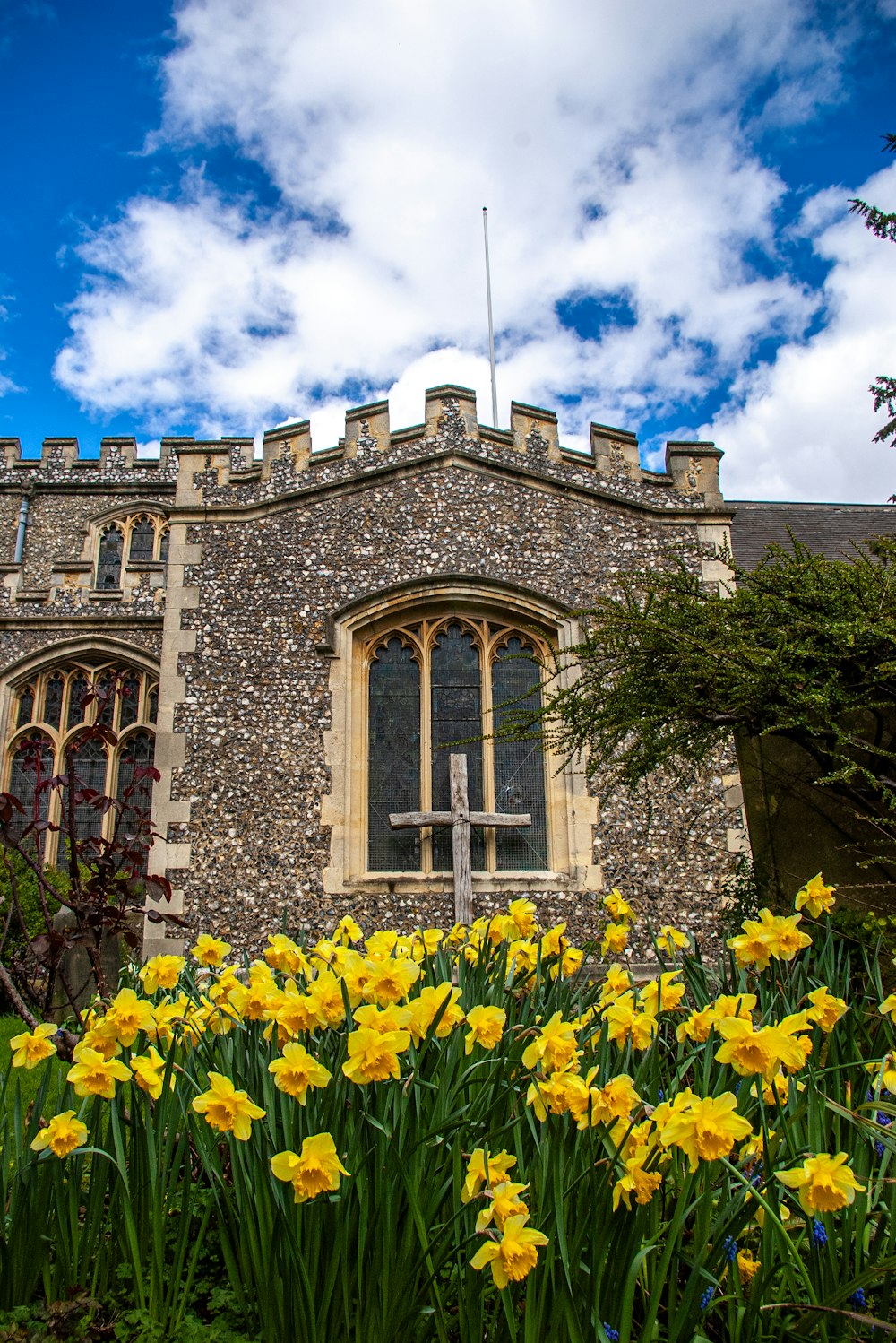 a building with a bunch of flowers in front of it