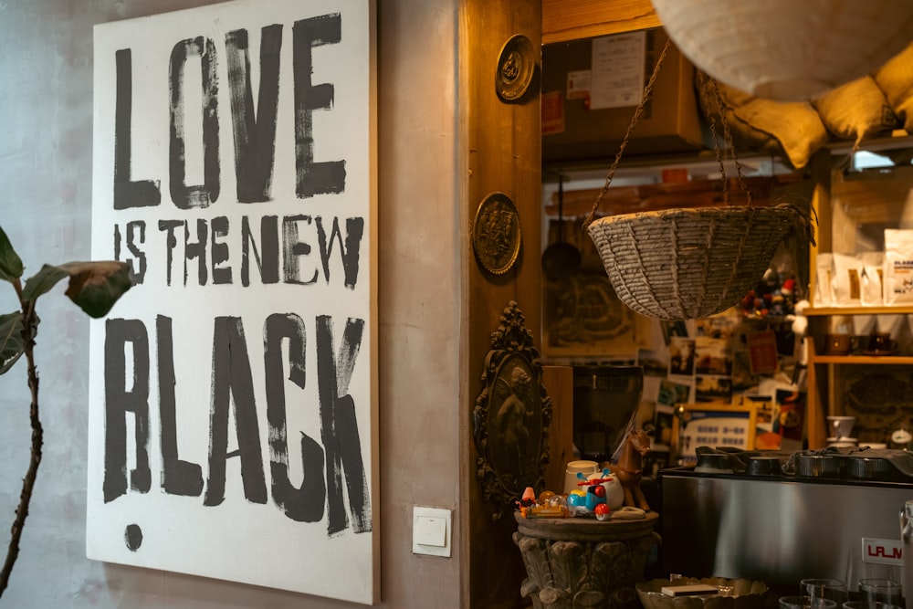 a sign that says love is the new black