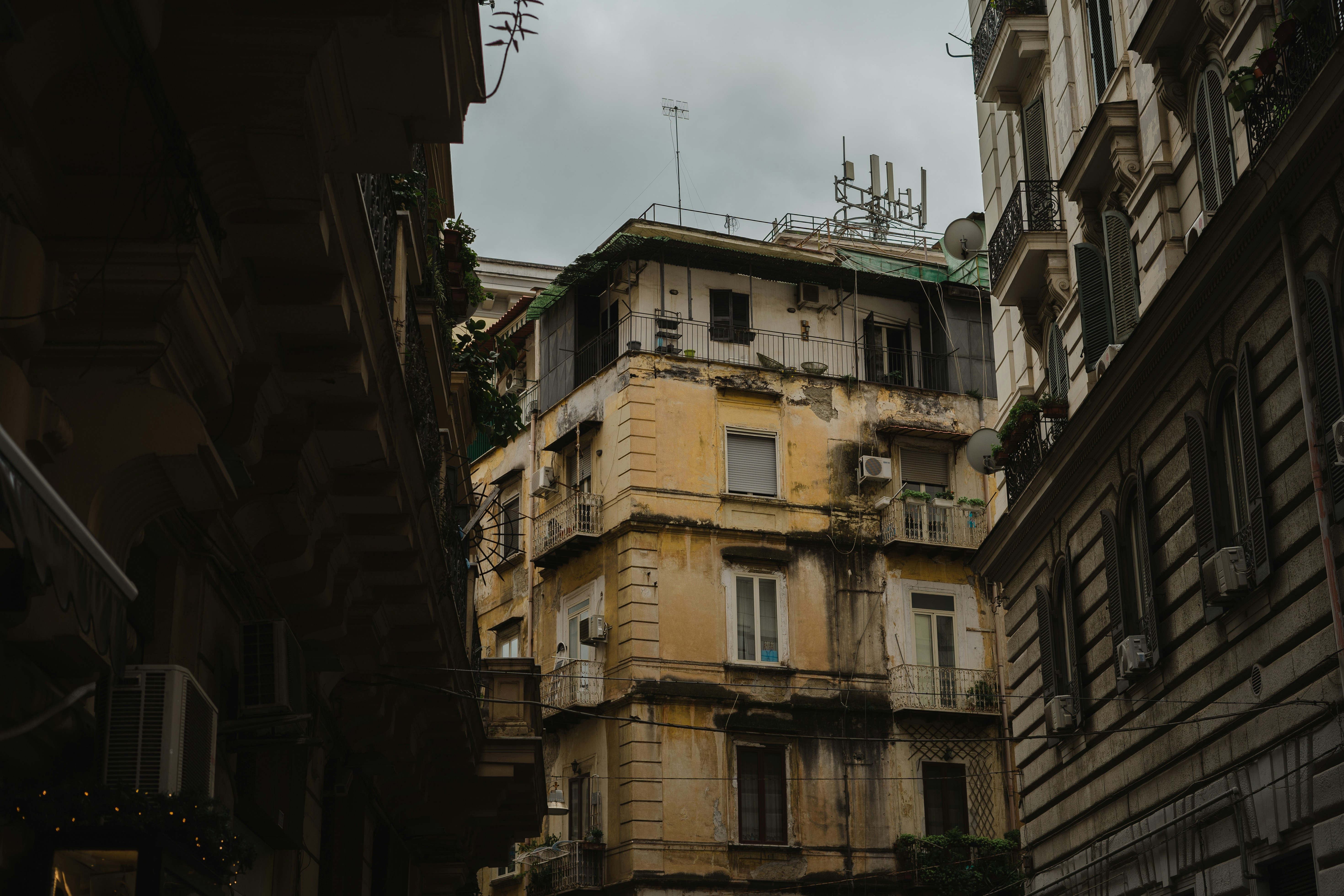 a tall building with lots of windows and balconies