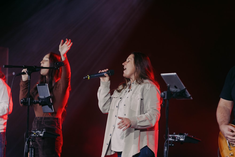 a group of people standing on top of a stage