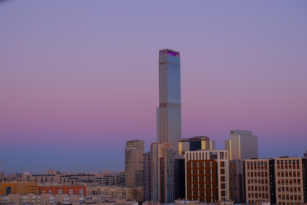 a very tall building towering over a city