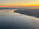 Panoramic shot of the Puente de las Américas stretching over the Panama Canal at sunset