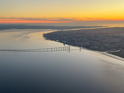Panoramic shot of the Puente de las Américas stretching over the Panama Canal at sunset
