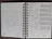 Close-up of a notebook filled with neat handwritten notes and sketches of Harappan seals.