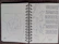 Close-up of a notebook filled with neat handwritten notes and sketches of Harappan seals.