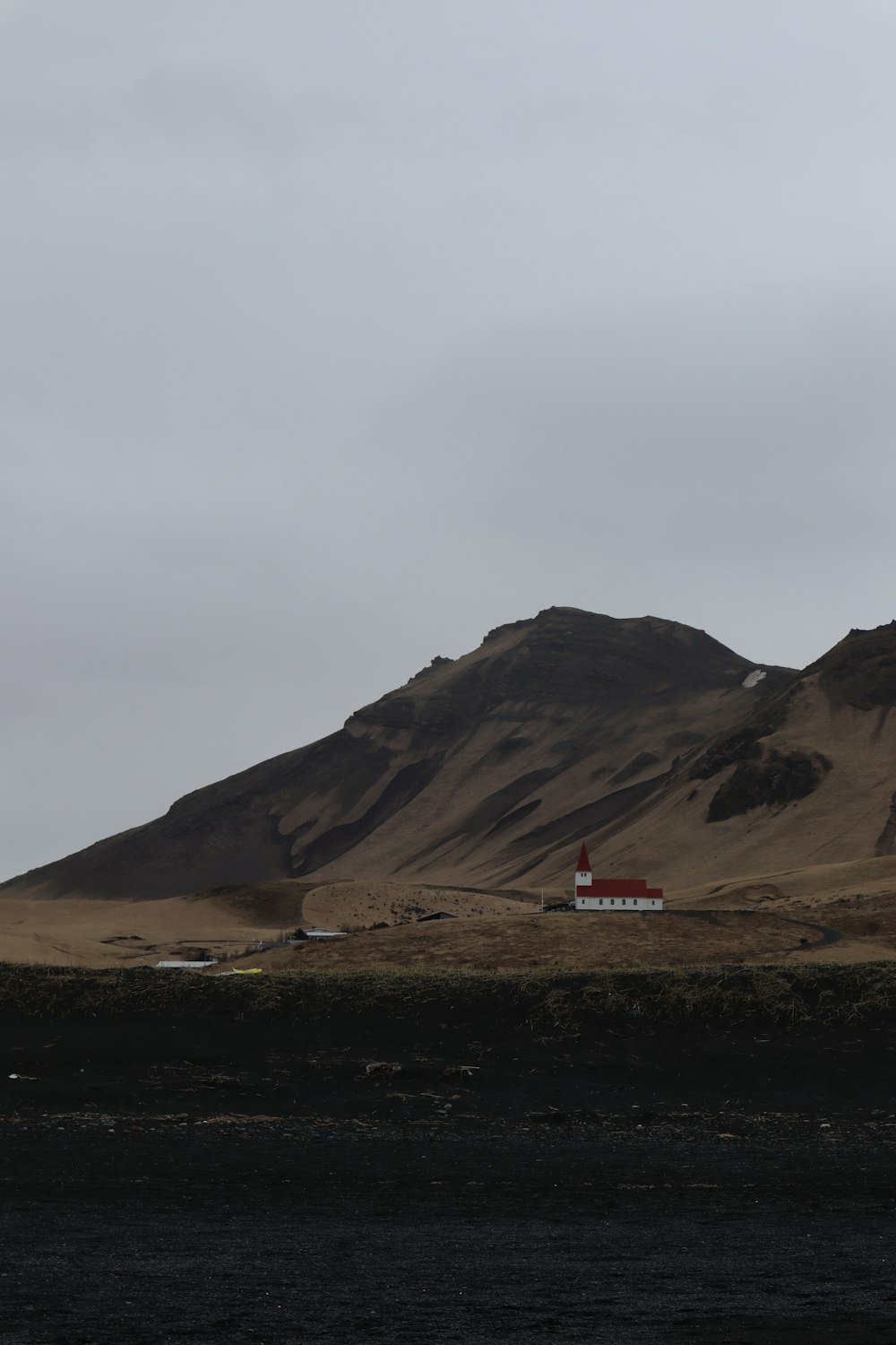 a small house in the middle of a desert