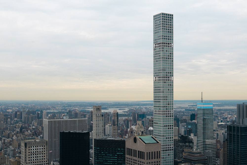 a very tall building towering over a city