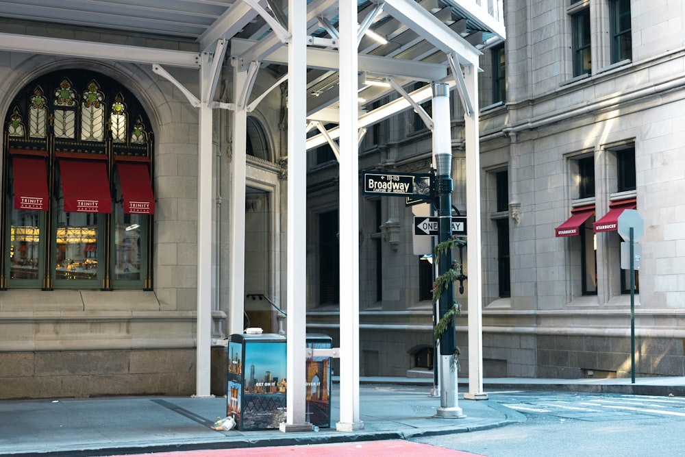 a street corner with a street sign and a building in the background