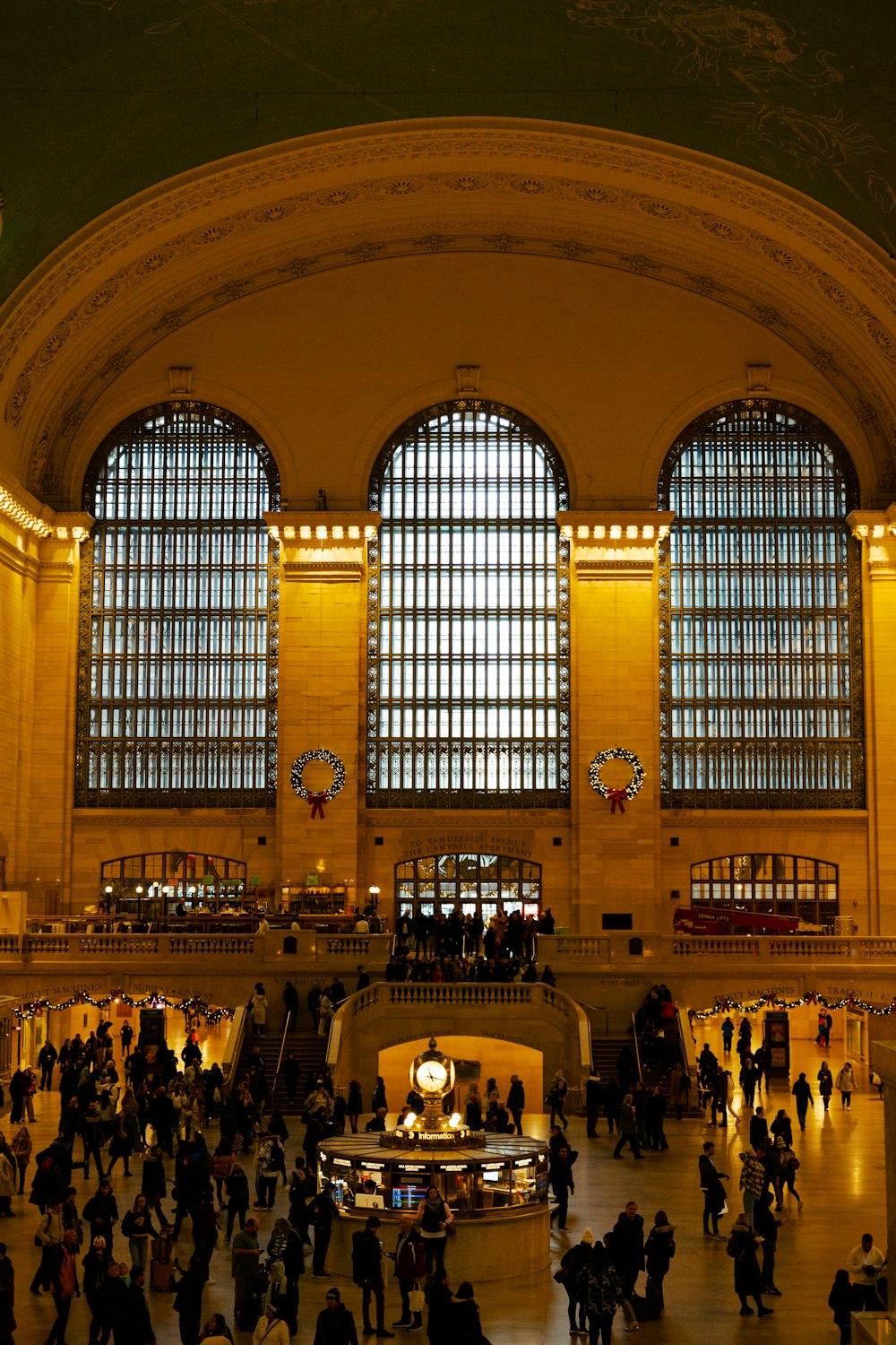 a group of people standing around a train station