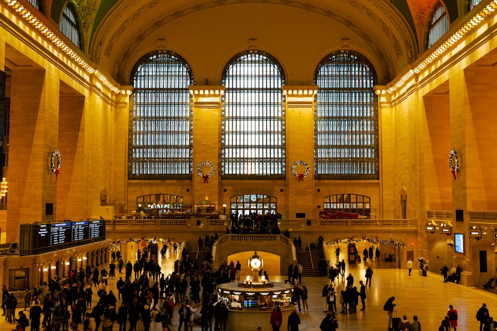 a group of people standing in a large building