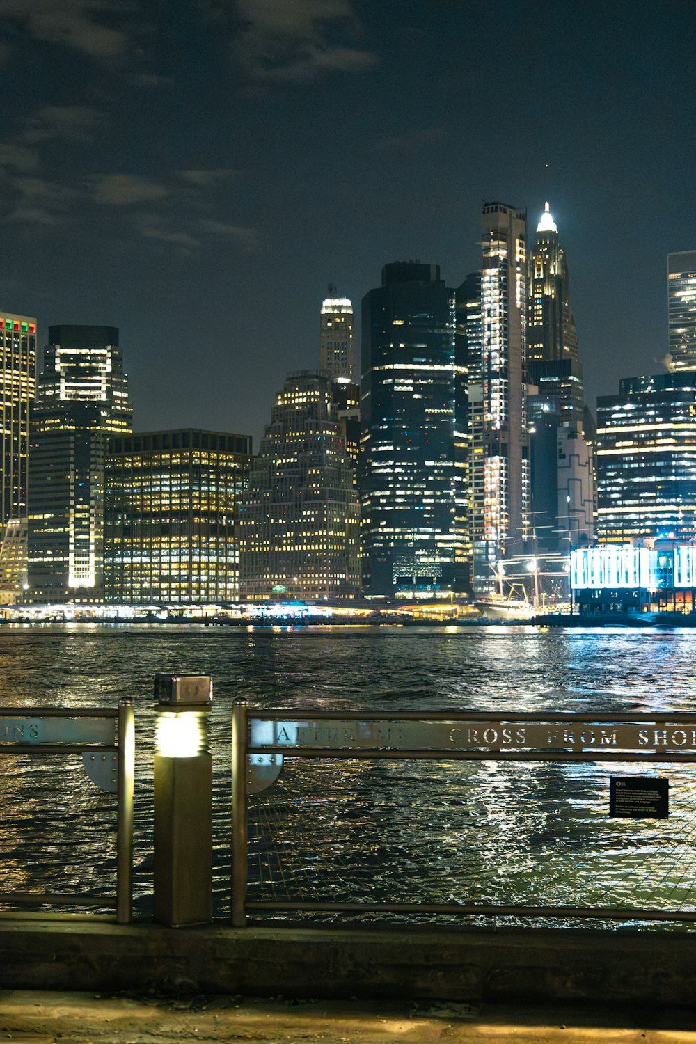 a night view of a city skyline and a body of water