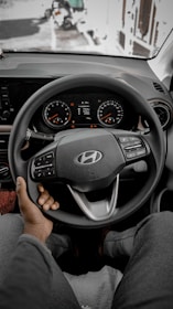 a man driving a car on a snowy day