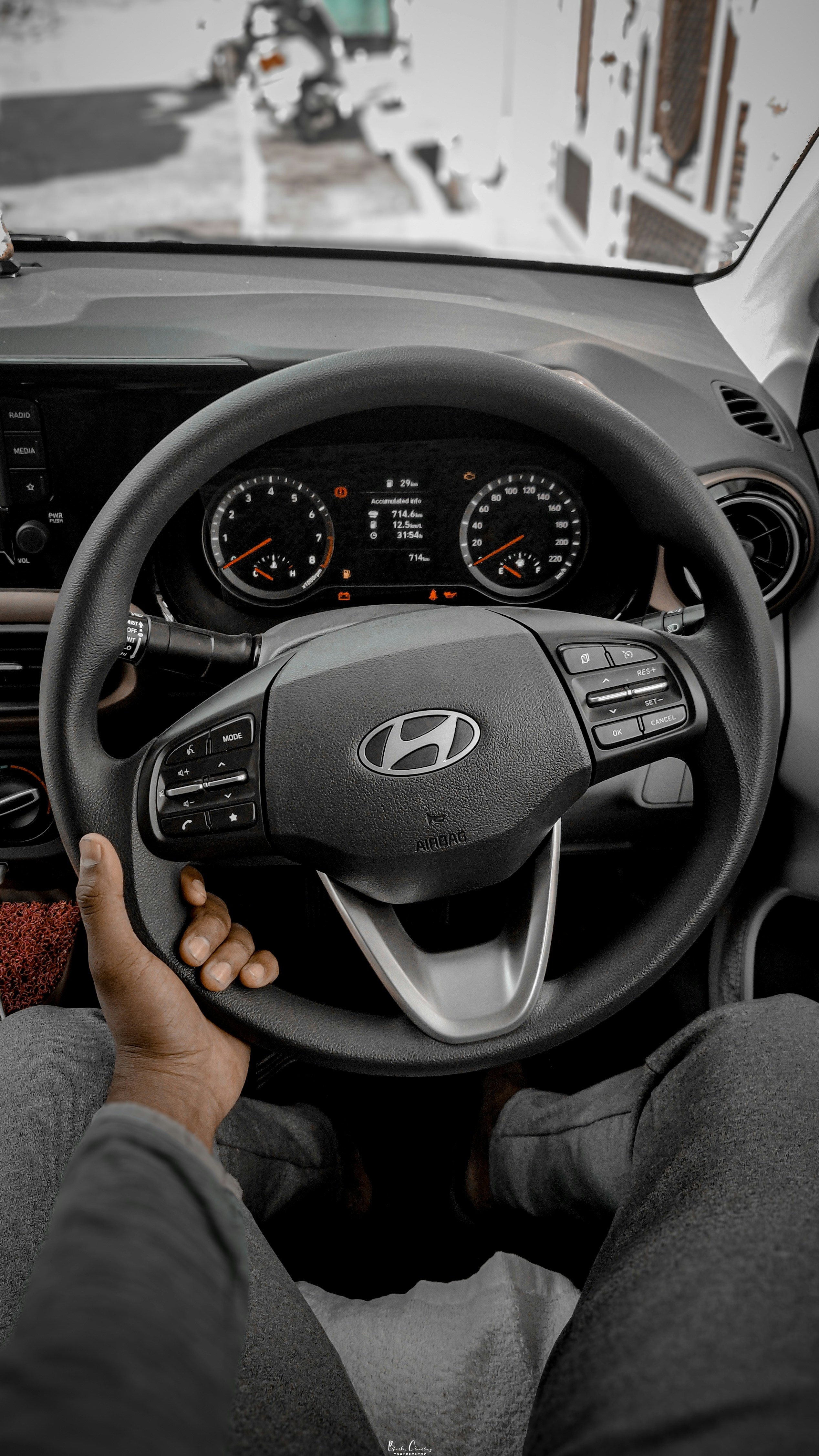 a man driving a car on a snowy day