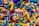 A colorful assortment of keychains featuring small sneaker and basketball designs, with various branding labels. The items are densely packed, displaying a mix of shapes and vibrant colors such as yellow, green, blue, red, and black.