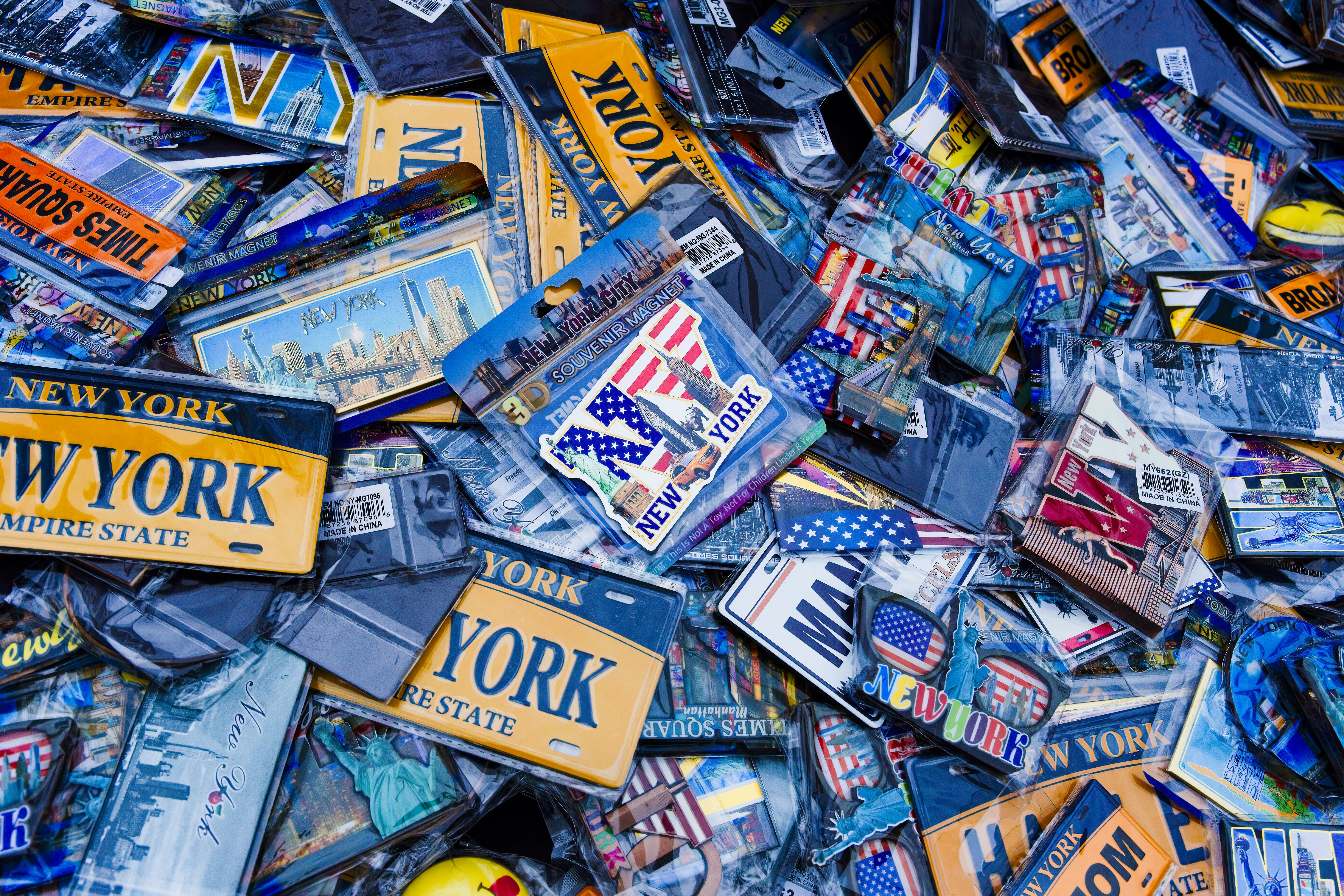 a pile of new york state license plates