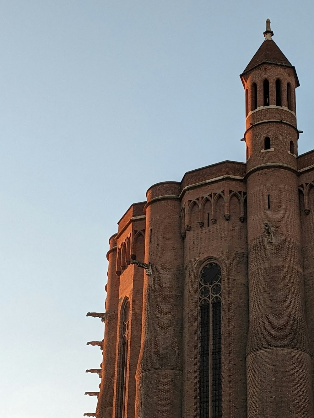 a large brick building with a clock tower