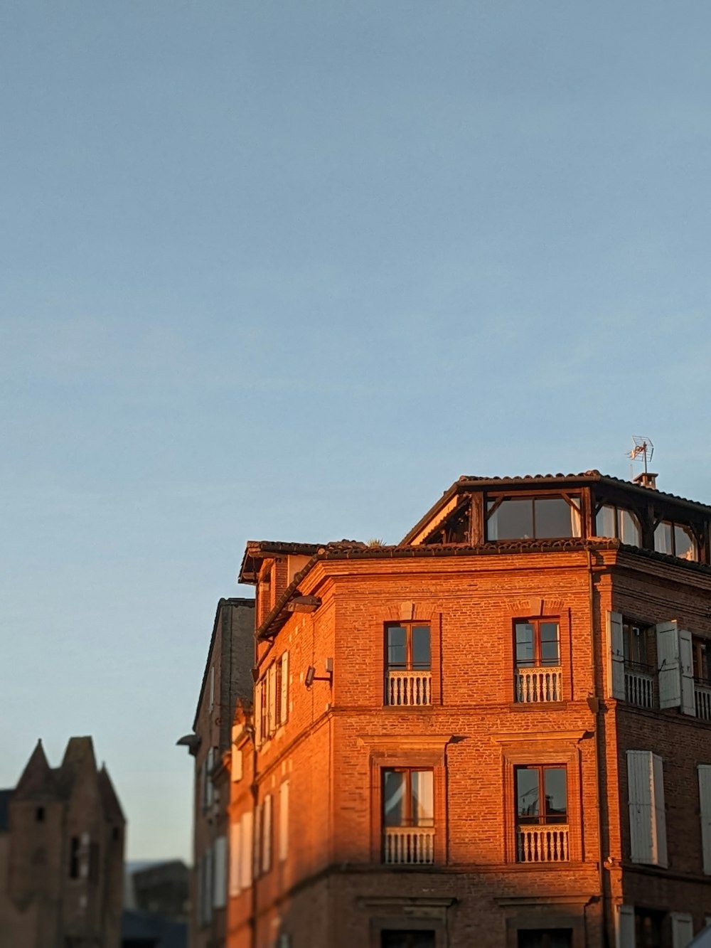 a tall building with a clock on the top of it