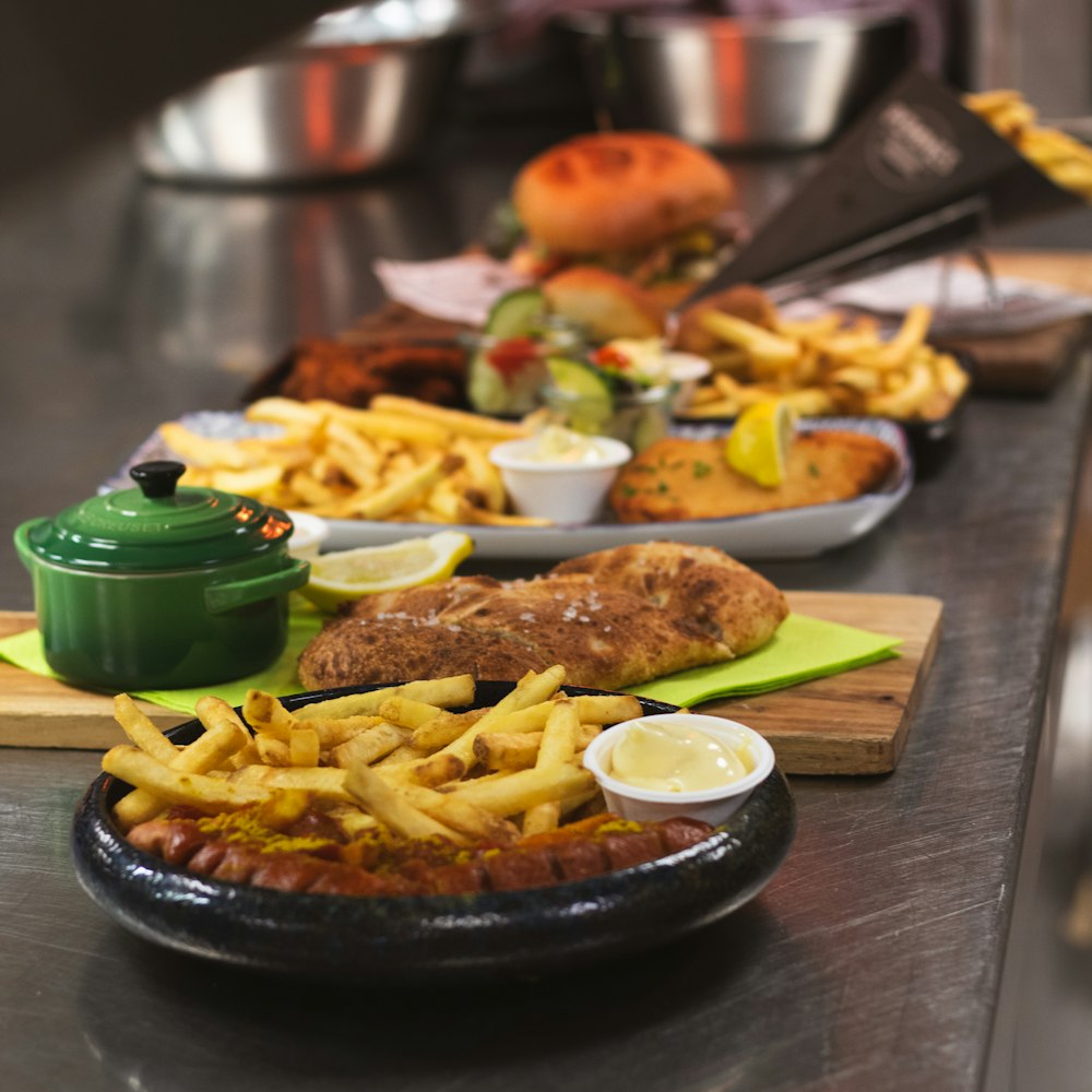 a counter with plates of food on it