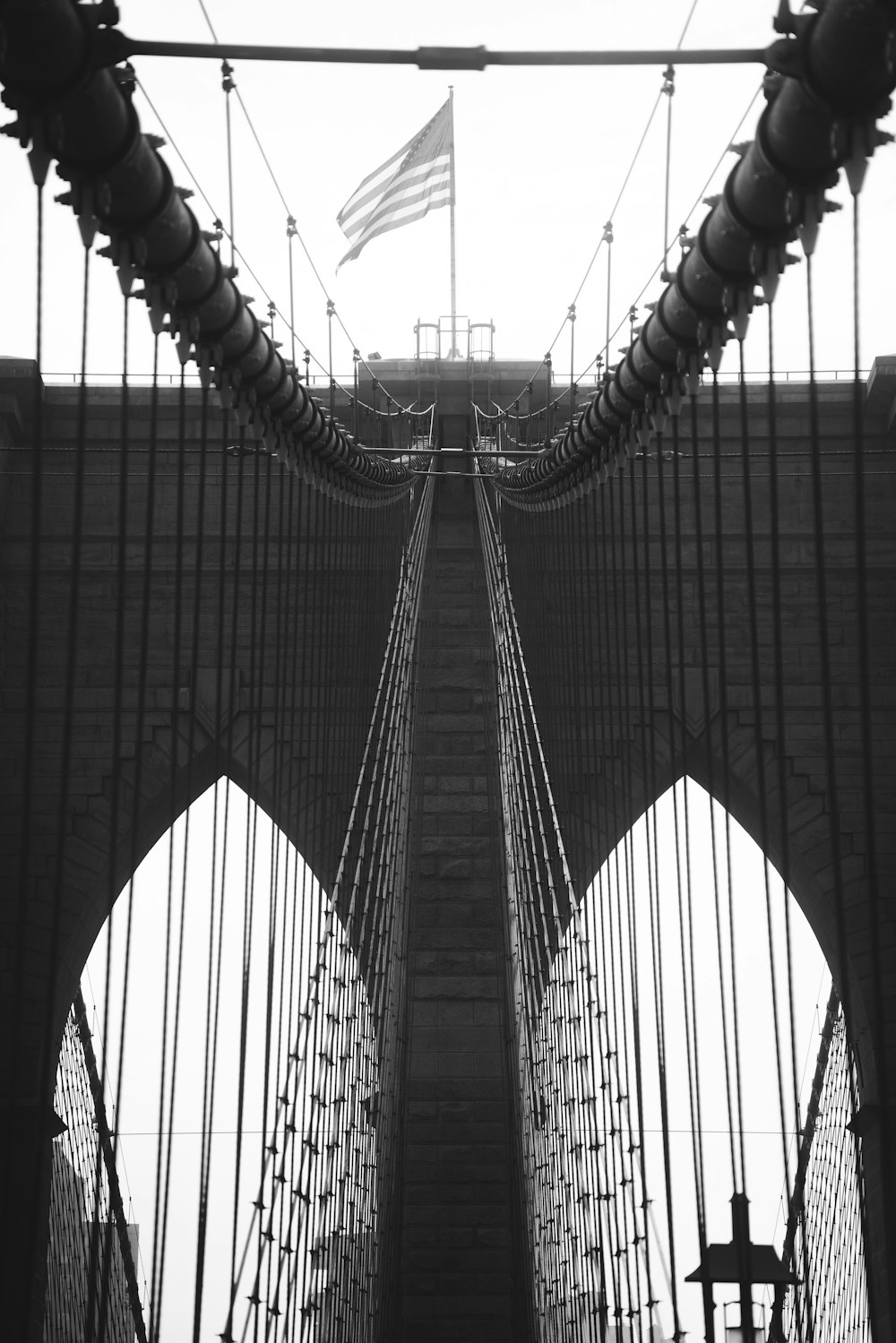 a black and white photo of a bridge