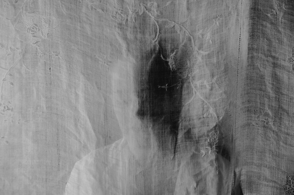 a black and white photo of a curtain