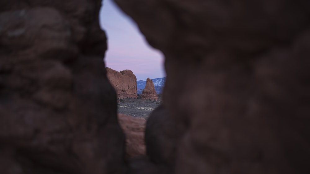 a view through a hole in a rock formation