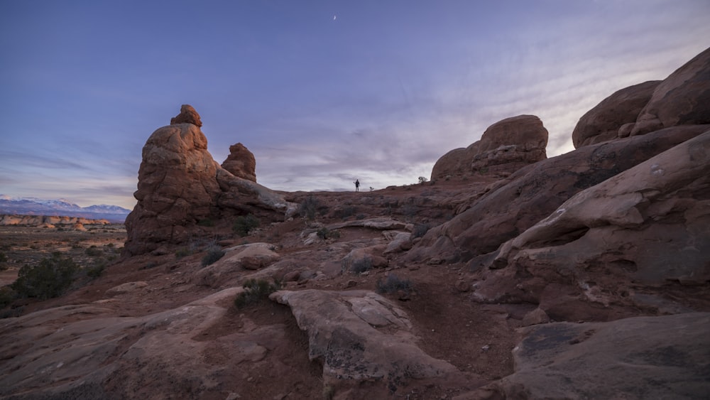 a large rock formation in the middle of a desert