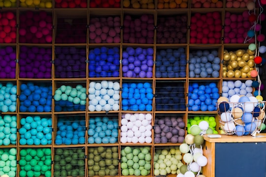 A beautifully arranged display of finished crochet items and yarn.