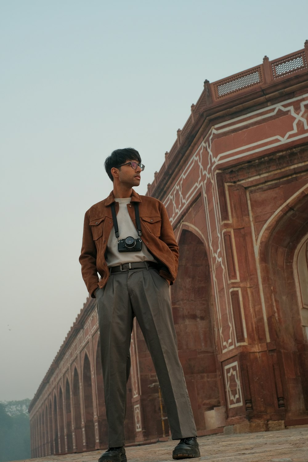 a man standing in front of a building