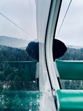 Inside view of a well-maintained taxi with comfortable seating and mountain views.