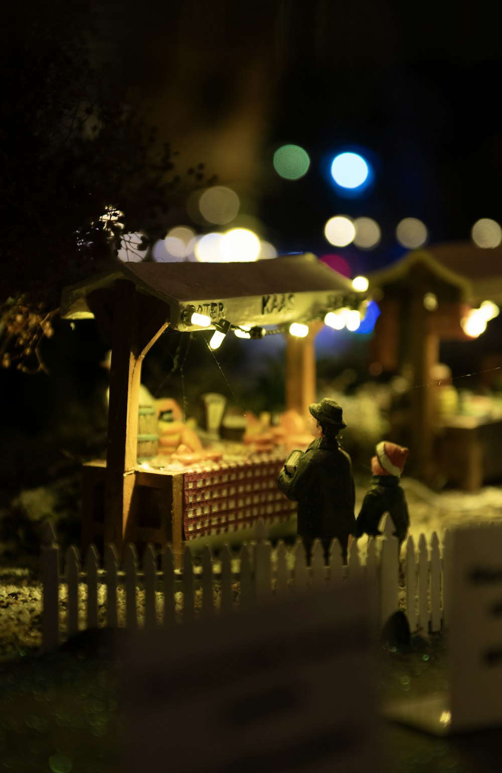 a toy figurine of a man sitting at a table