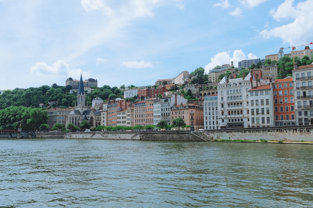 a body of water with a bunch of buildings on the side of it