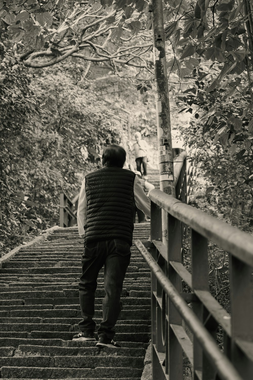 a man walking up a flight of stairs