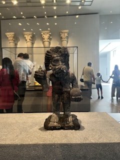 Close-up of a detailed sculpture displayed in a historic museum during one of our guided tours