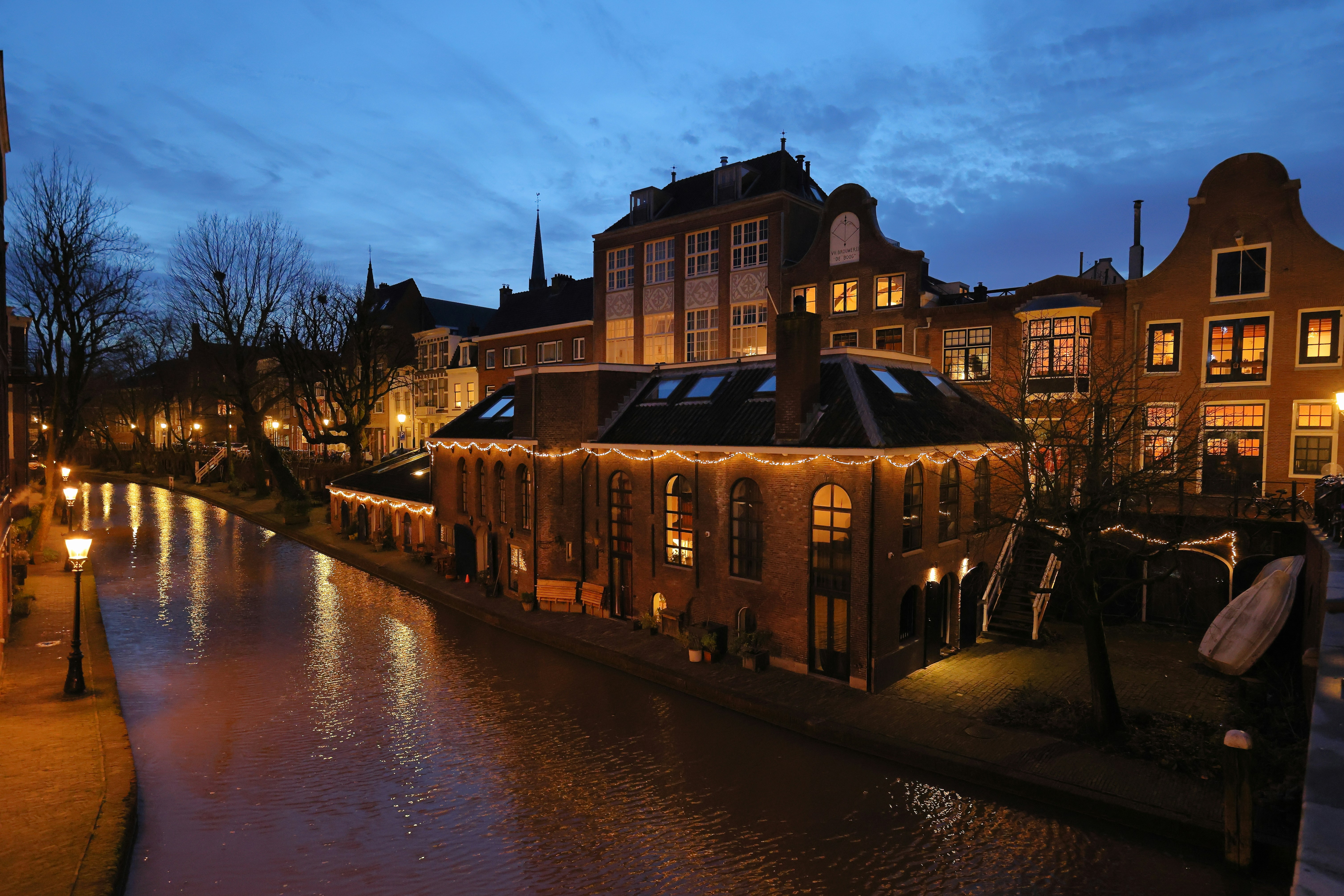 a river running through a city next to tall buildings
