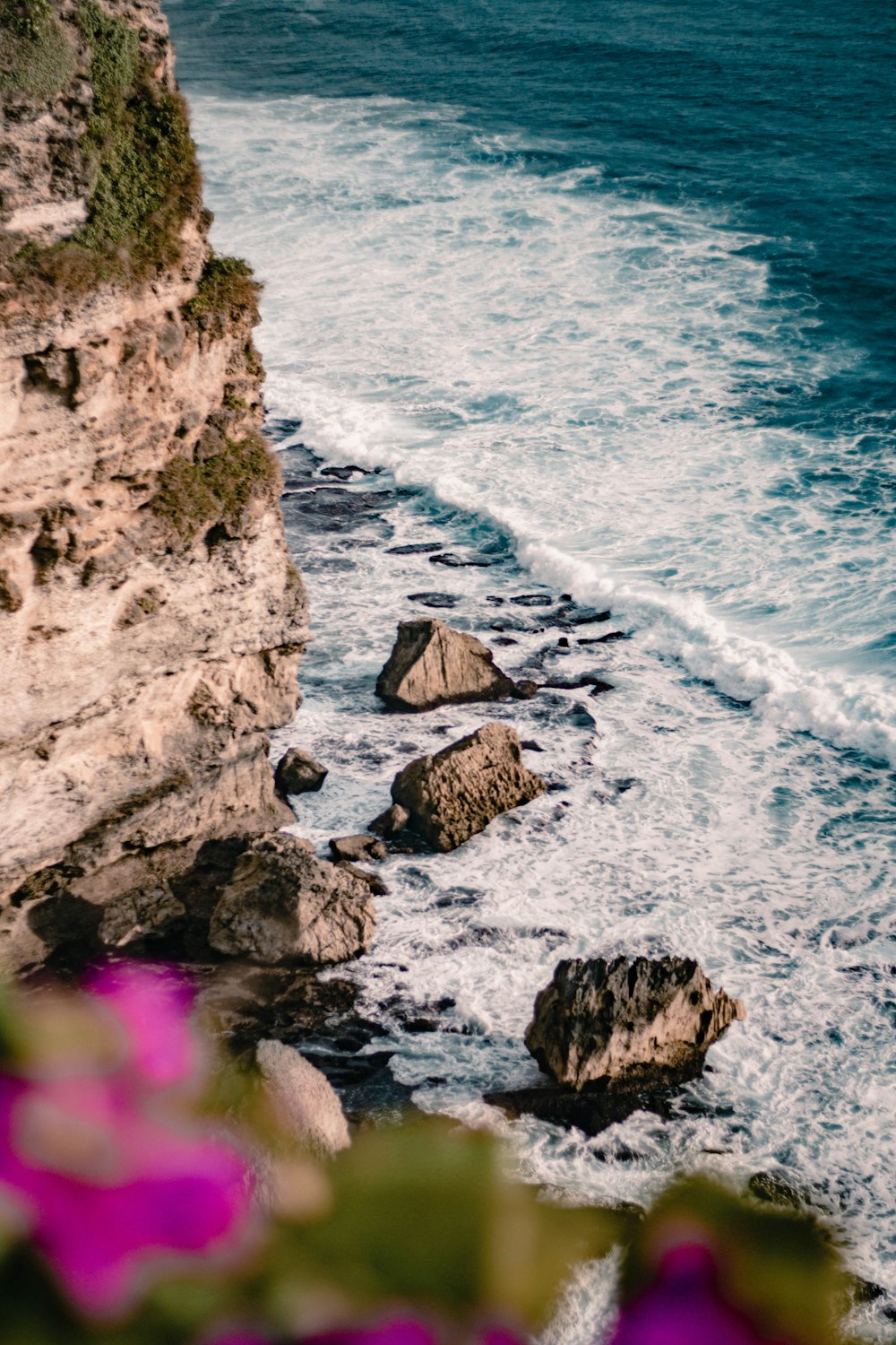 a view of the ocean from the top of a cliff