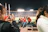 Photo of a corporate sports event with employees enjoying team activities under stadium lights.