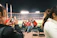 Photo of a corporate sports event with employees enjoying team activities under stadium lights.