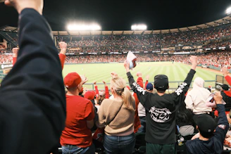 Activation event with athletes wearing branded sportswear in a lively stadium.
