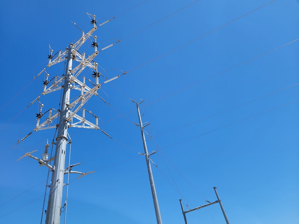 a tall metal pole with lots of wires on top of it