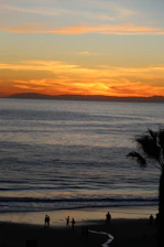 Cuban travelers enjoying a vibrant Caribbean beach sunset
